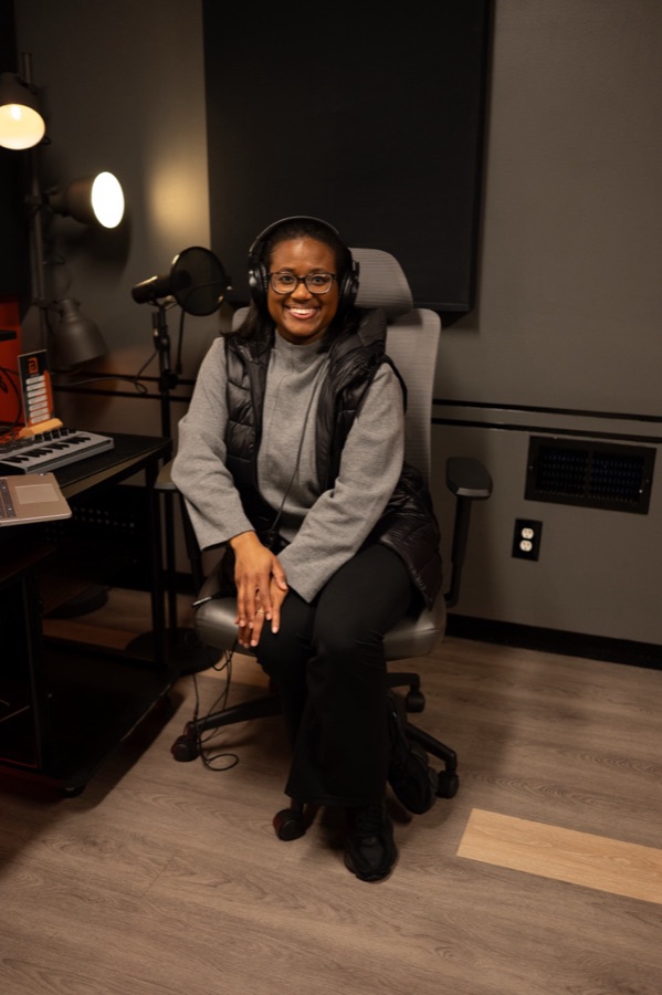 Tiffany S. Jones recording the Moms Who Pause podcast in studio