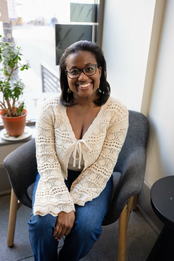 Tiffany S. Jones smiling, seated indoors